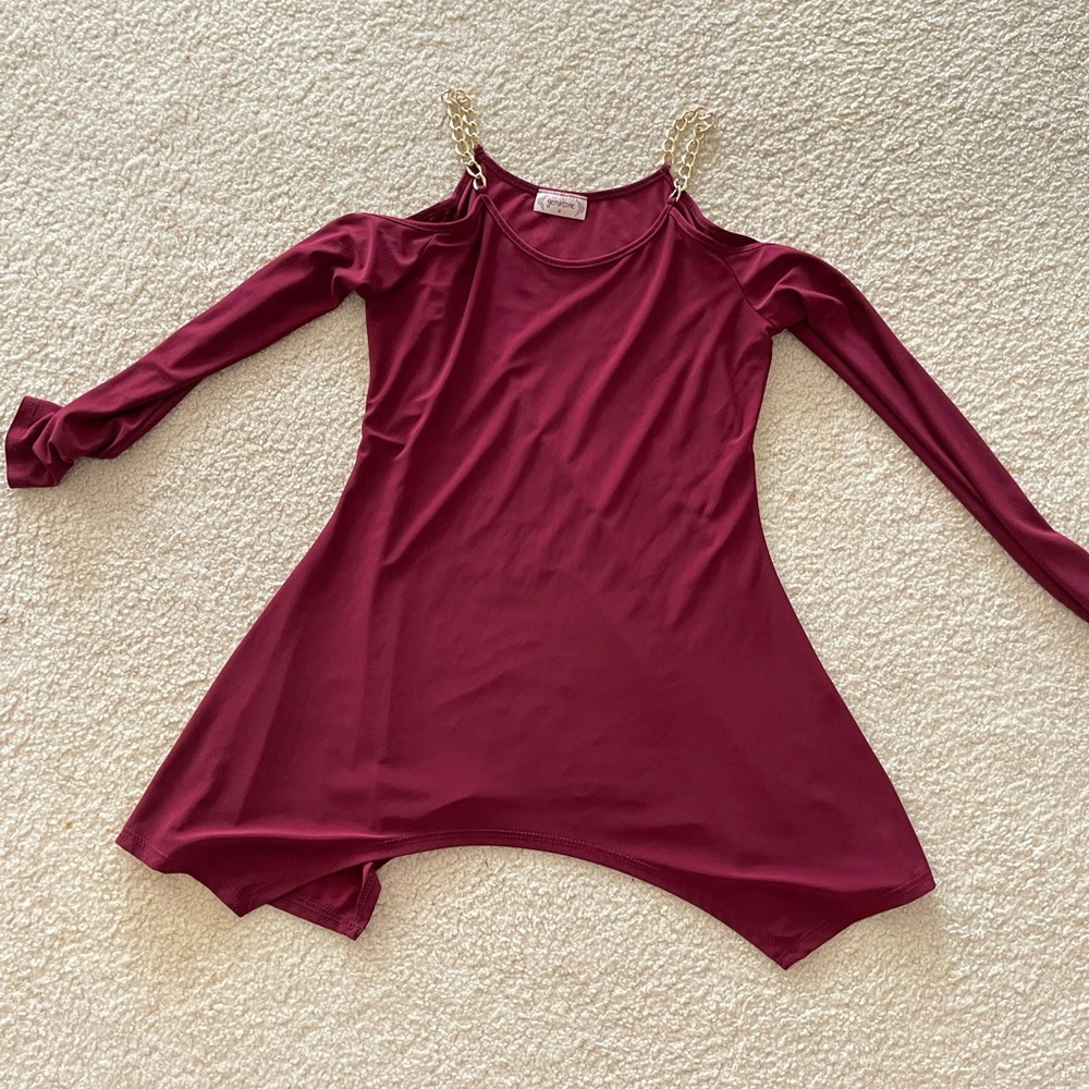 Cold shoulder, long sleeved, maroon top with gold chain accent